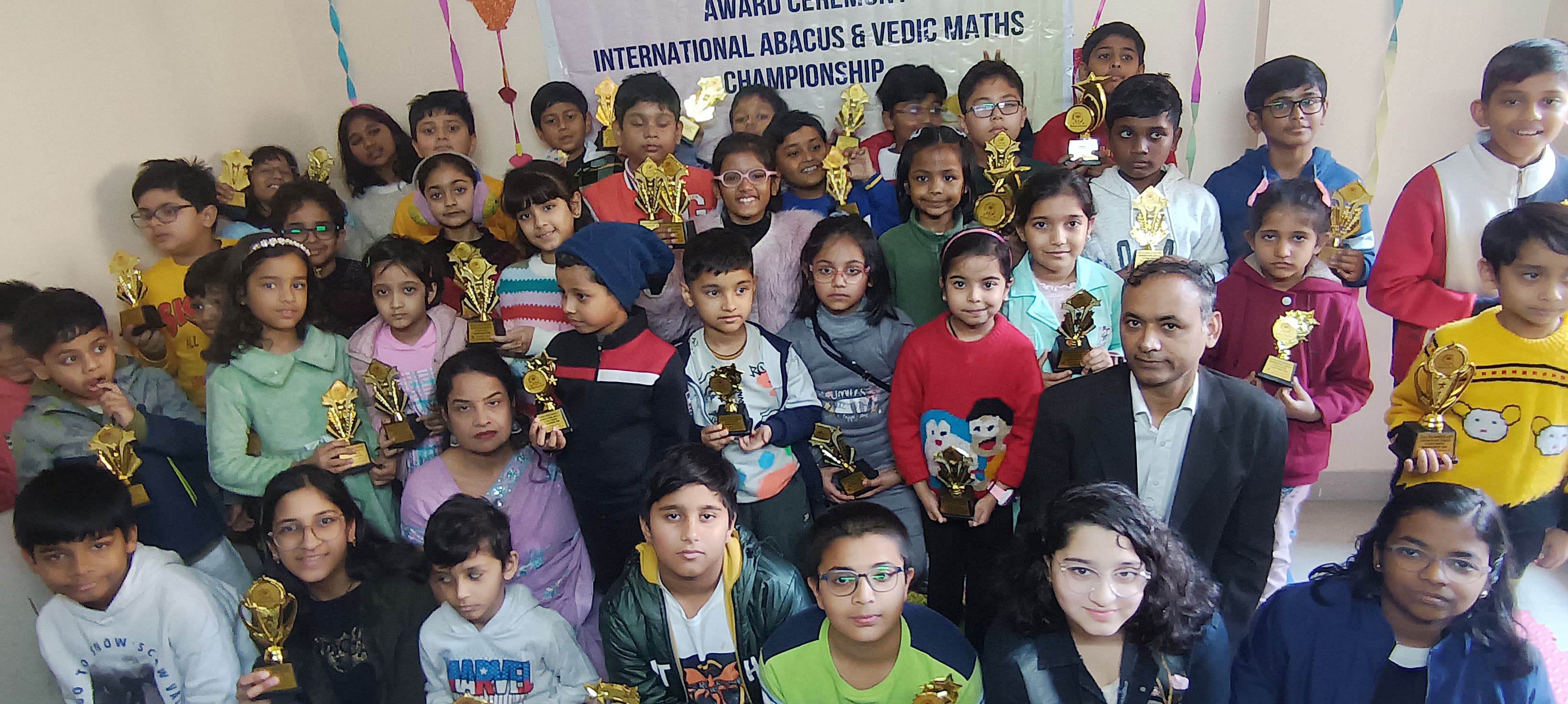 Kid receiving Championship trophies